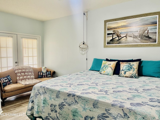 2252 Beach Dr Unit 305, Gulfport, MS 39507 - bedroom featuring wood finished floors and french doors