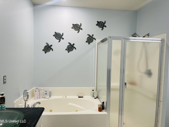 2252 Beach Dr Unit 305, Gulfport, MS 39507 - full bathroom featuring a stall shower, a tub with jets, and vanity