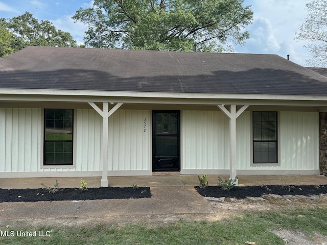 doorway to property with a porch