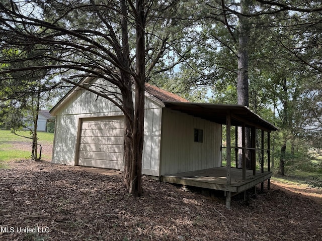 exterior space featuring an outdoor structure and a garage