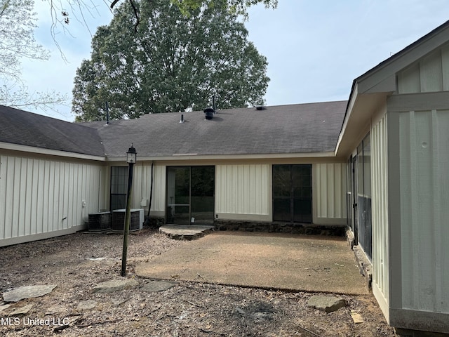 rear view of property with a patio area and cooling unit