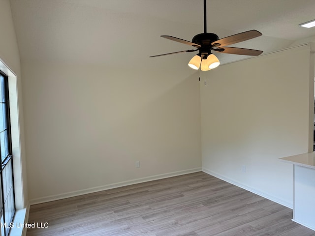 empty room featuring ceiling fan and light wood-type flooring