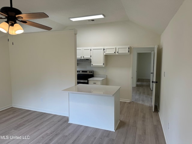 kitchen with light hardwood / wood-style flooring, lofted ceiling, white cabinets, and electric stove