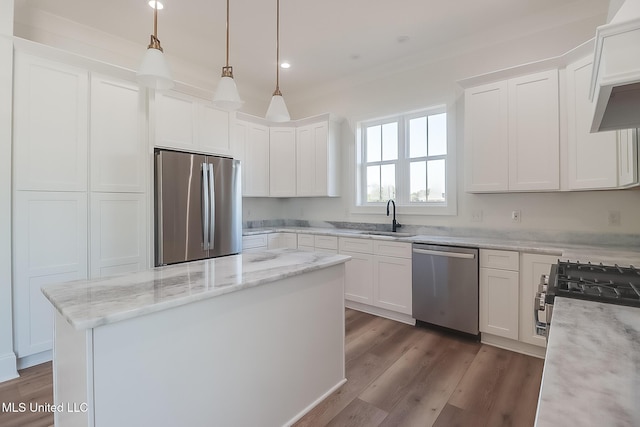 kitchen with light stone countertops, appliances with stainless steel finishes, dark hardwood / wood-style floors, and white cabinets