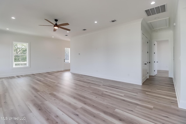 empty room featuring crown molding, light hardwood / wood-style flooring, and ceiling fan