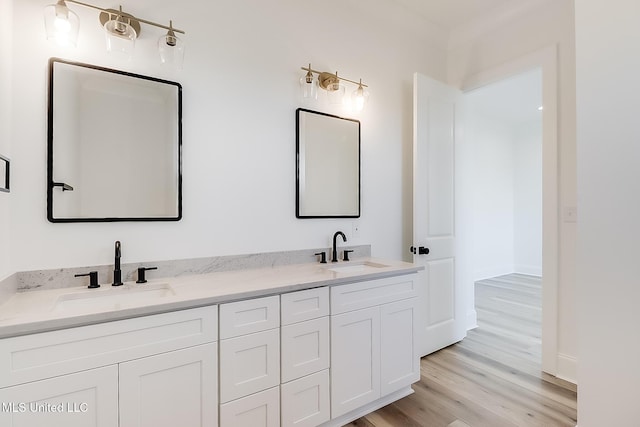 bathroom with vanity and hardwood / wood-style flooring