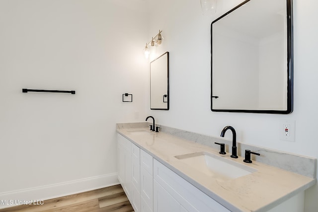 bathroom featuring vanity and wood-type flooring