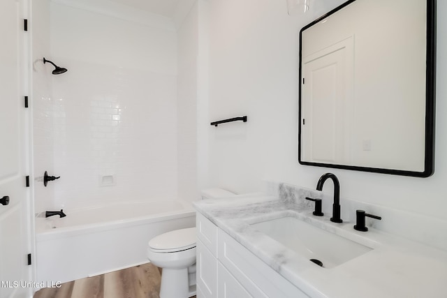 full bathroom with hardwood / wood-style floors, vanity, toilet, and shower / bathing tub combination