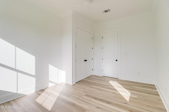 spare room featuring light hardwood / wood-style flooring