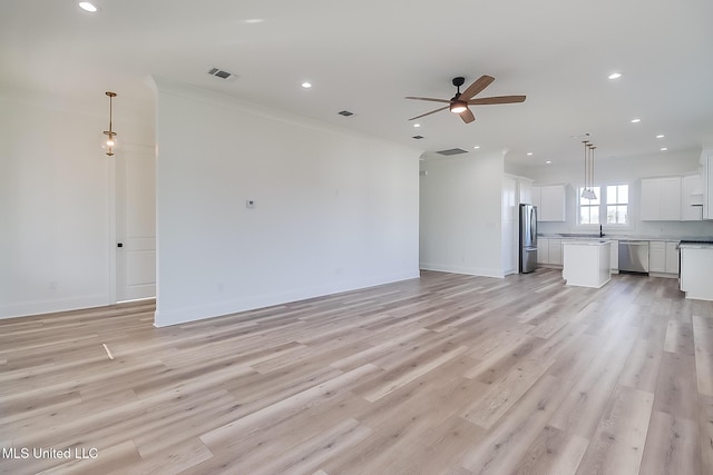 unfurnished living room featuring light wood-type flooring, recessed lighting, and a ceiling fan