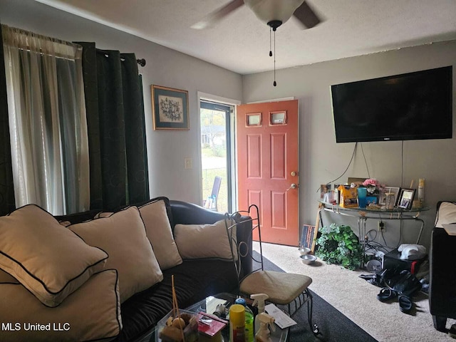 carpeted living room featuring ceiling fan