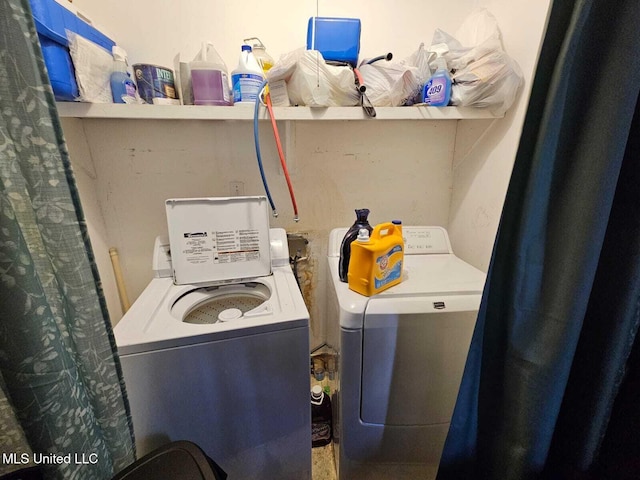 clothes washing area with independent washer and dryer