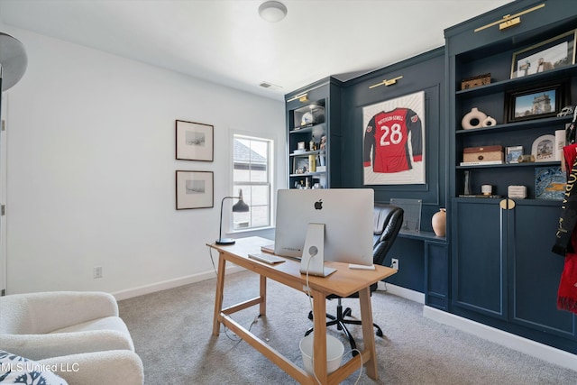 office area with carpet flooring, baseboards, and visible vents