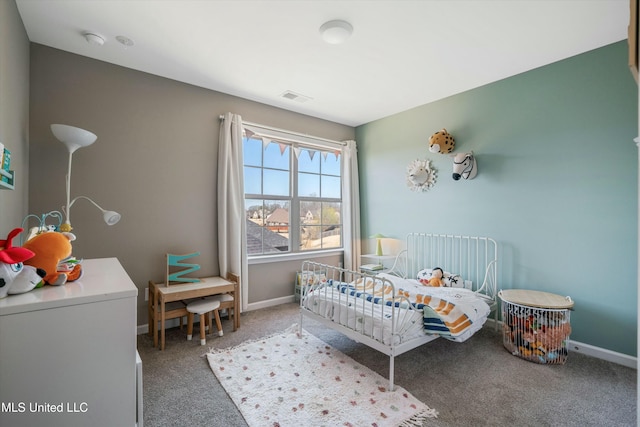 carpeted bedroom featuring baseboards and visible vents