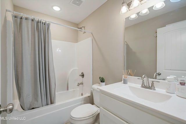 bathroom with visible vents, toilet, shower / bath combo, and vanity