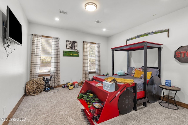 carpeted bedroom with recessed lighting, visible vents, and baseboards