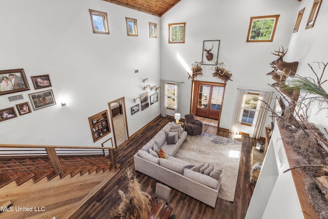 interior space featuring wood ceiling, high vaulted ceiling, and wood finished floors