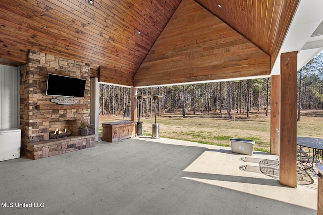 view of patio / terrace featuring an outdoor stone fireplace