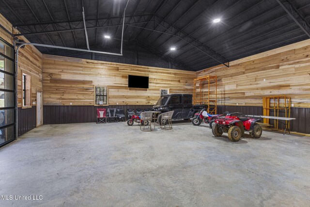 garage featuring wooden walls