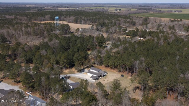 drone / aerial view with a rural view and a view of trees