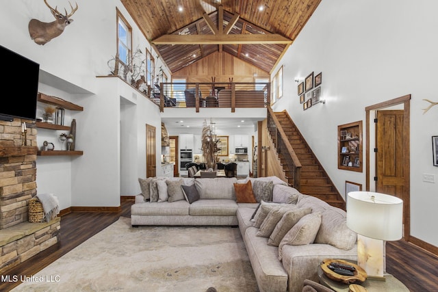 living room featuring stairs, wooden ceiling, beam ceiling, and wood finished floors