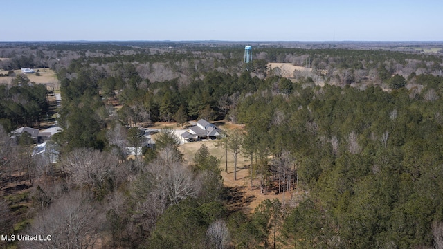 bird's eye view featuring a wooded view