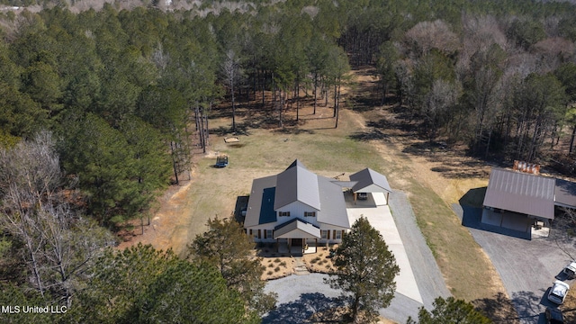 drone / aerial view with a view of trees