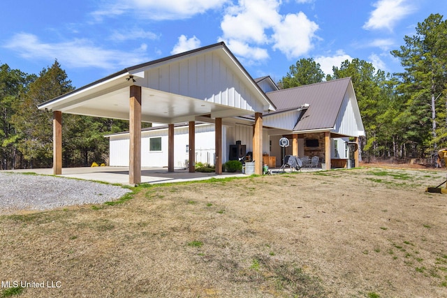 view of front facade with metal roof and board and batten siding