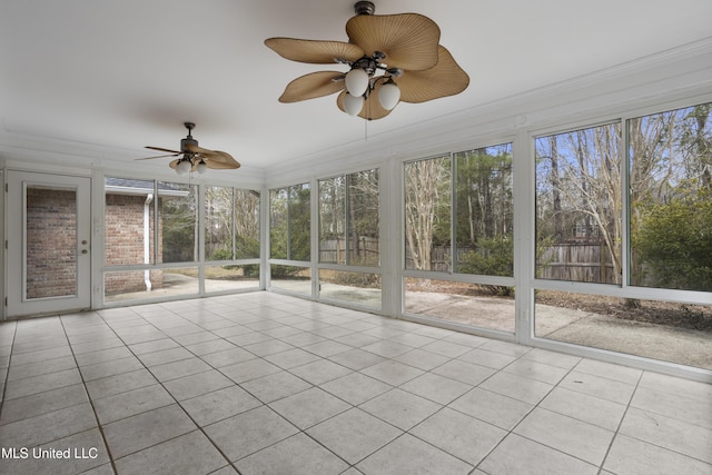 unfurnished sunroom with a ceiling fan and a healthy amount of sunlight