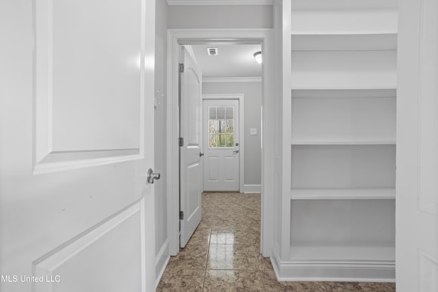 corridor with visible vents and crown molding