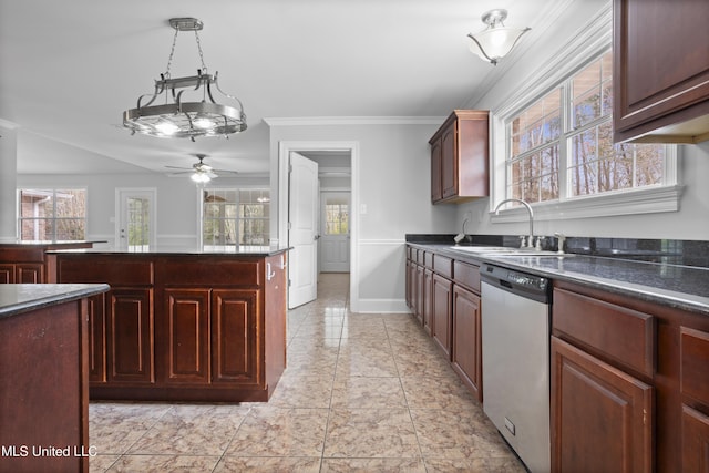 kitchen with ornamental molding, a healthy amount of sunlight, dishwasher, and a sink