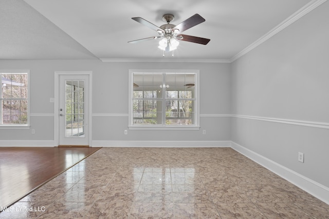 empty room with a ceiling fan, a wealth of natural light, ornamental molding, and baseboards