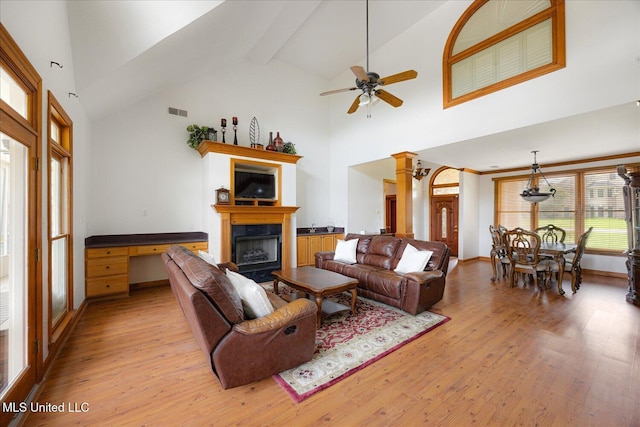 4872 Bobo Pl, Olive Branch, MS 38654 - living room with light wood finished floors, a ceiling fan, high vaulted ceiling, a fireplace, and baseboards