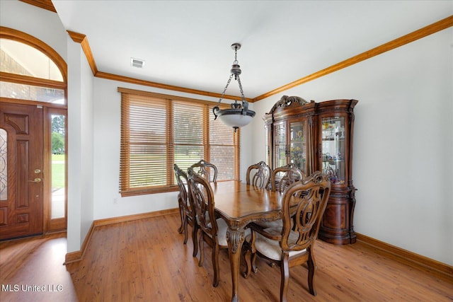 4872 Bobo Pl, Olive Branch, MS 38654 - dining room with baseboards, light wood-style floors, and ornamental molding