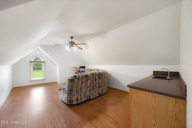 4872 Bobo Pl, Olive Branch, MS 38654 - sitting room with light wood-style floors, vaulted ceiling, baseboards, and ceiling fan