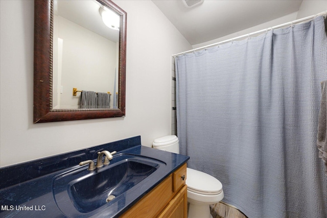 4872 Bobo Pl, Olive Branch, MS 38654 - bathroom featuring toilet, vanity, and curtained shower