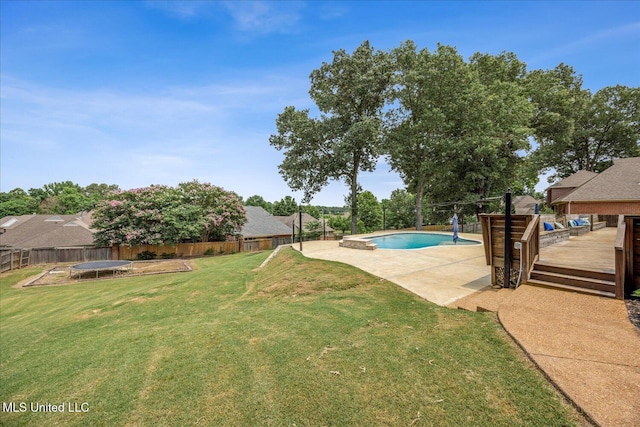 4872 Bobo Pl, Olive Branch, MS 38654 - view of yard featuring a trampoline, a wooden deck, and a patio