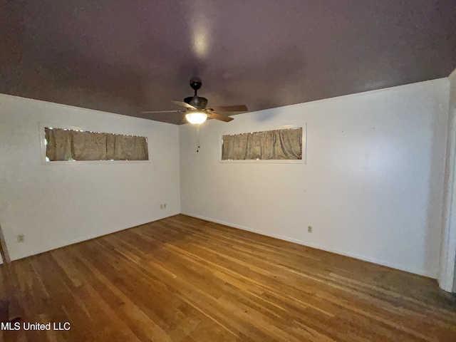 305 N Heard St, Senatobia, MS 38668 - empty room featuring a ceiling fan and wood finished floors