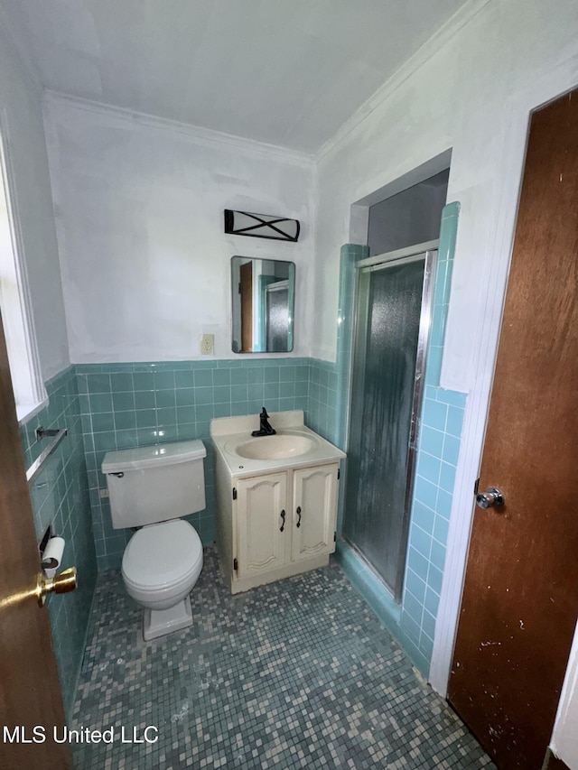 305 N Heard St, Senatobia, MS 38668 - full bathroom featuring tile walls, vanity, ornamental molding, a shower stall, and tile patterned flooring