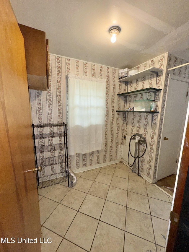 305 N Heard St, Senatobia, MS 38668 - bathroom with wallpapered walls and tile patterned floors