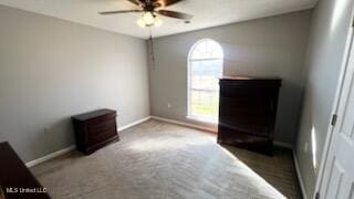 unfurnished bedroom with carpet flooring and ceiling fan