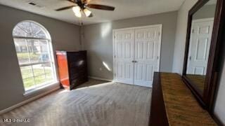 unfurnished bedroom featuring ceiling fan