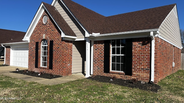 exterior space with a garage and a front lawn