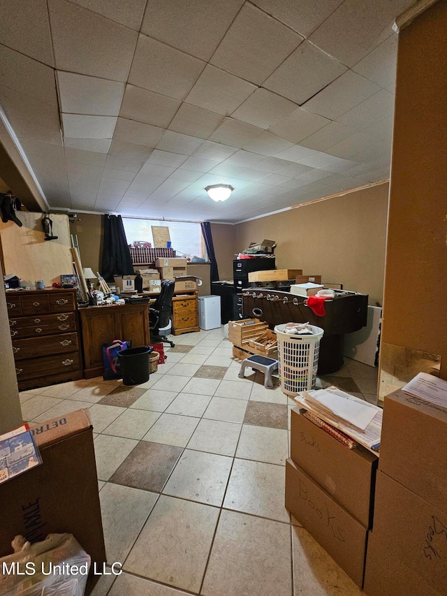 basement featuring light tile patterned floors