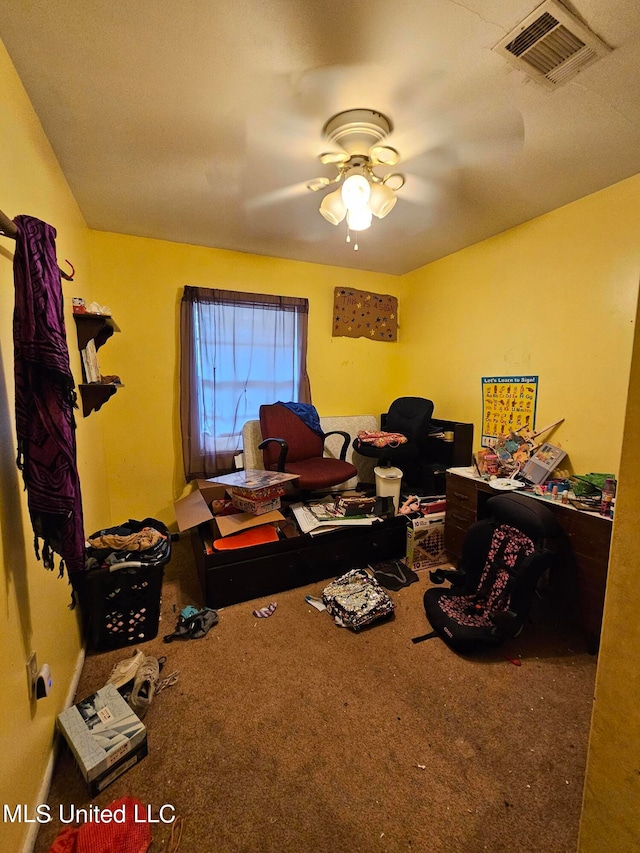 carpeted home office with ceiling fan