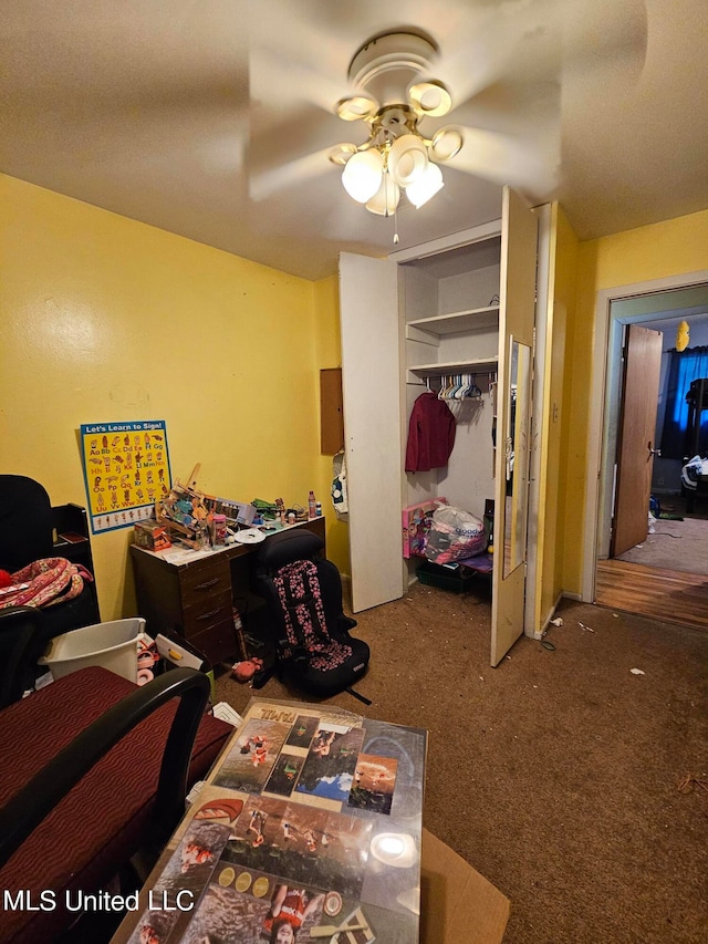 bedroom with a closet, carpet floors, and ceiling fan