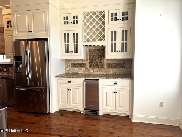 kitchen with stainless steel appliances, dark hardwood / wood-style floors, wine cooler, and light stone counters