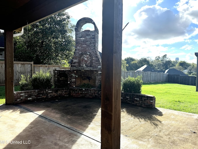 view of patio / terrace featuring an outdoor fireplace