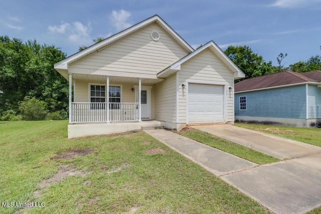 11599 Acorn Dr, Gulfport, MS 39503 - view of front facade with concrete driveway, a porch, a garage, and a front yard