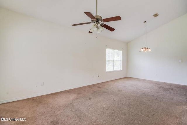 11599 Acorn Dr, Gulfport, MS 39503 - carpeted empty room with a chandelier, ceiling fan, baseboards, and high vaulted ceiling